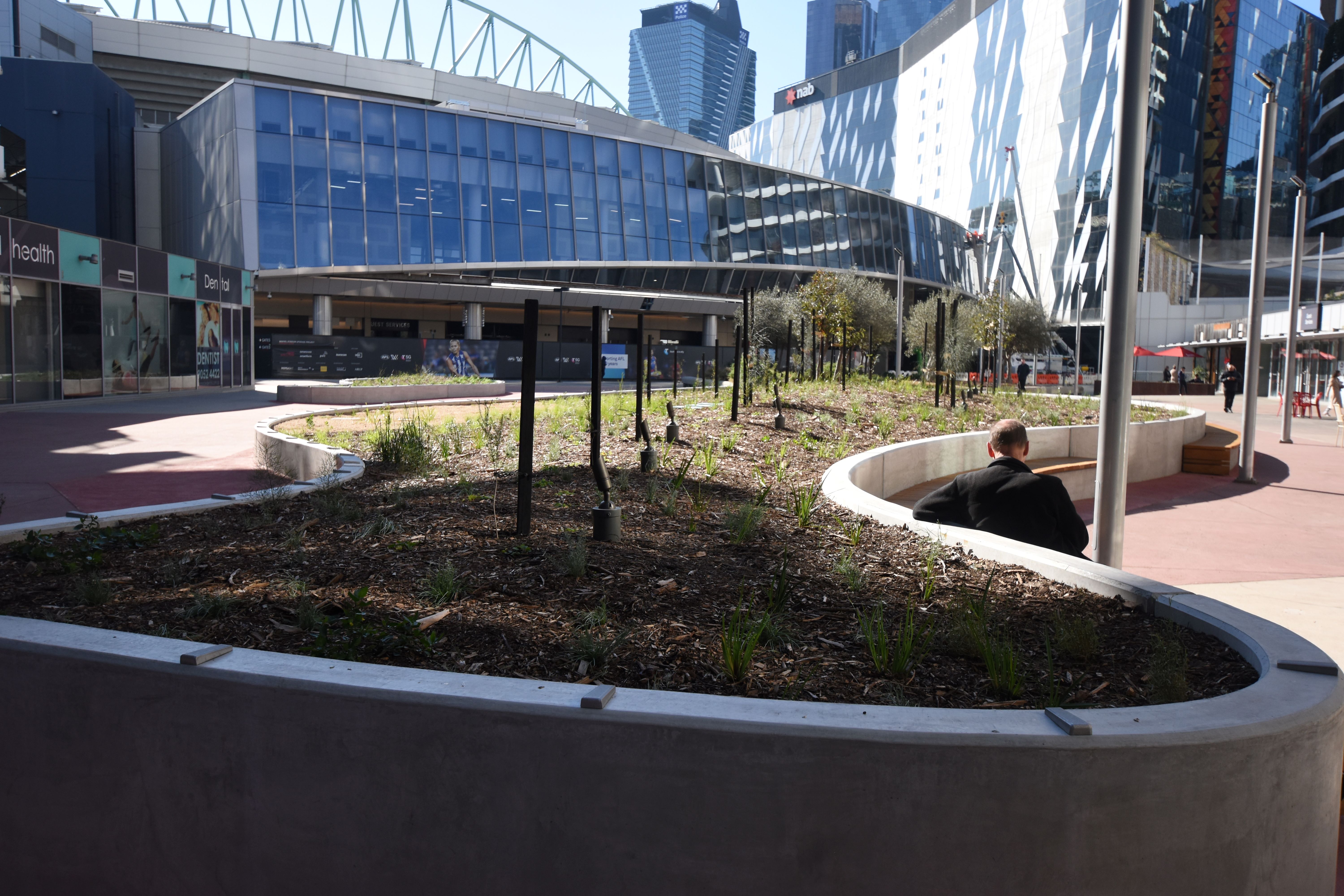 Victoria Point landscaping completion - man sitting and reading