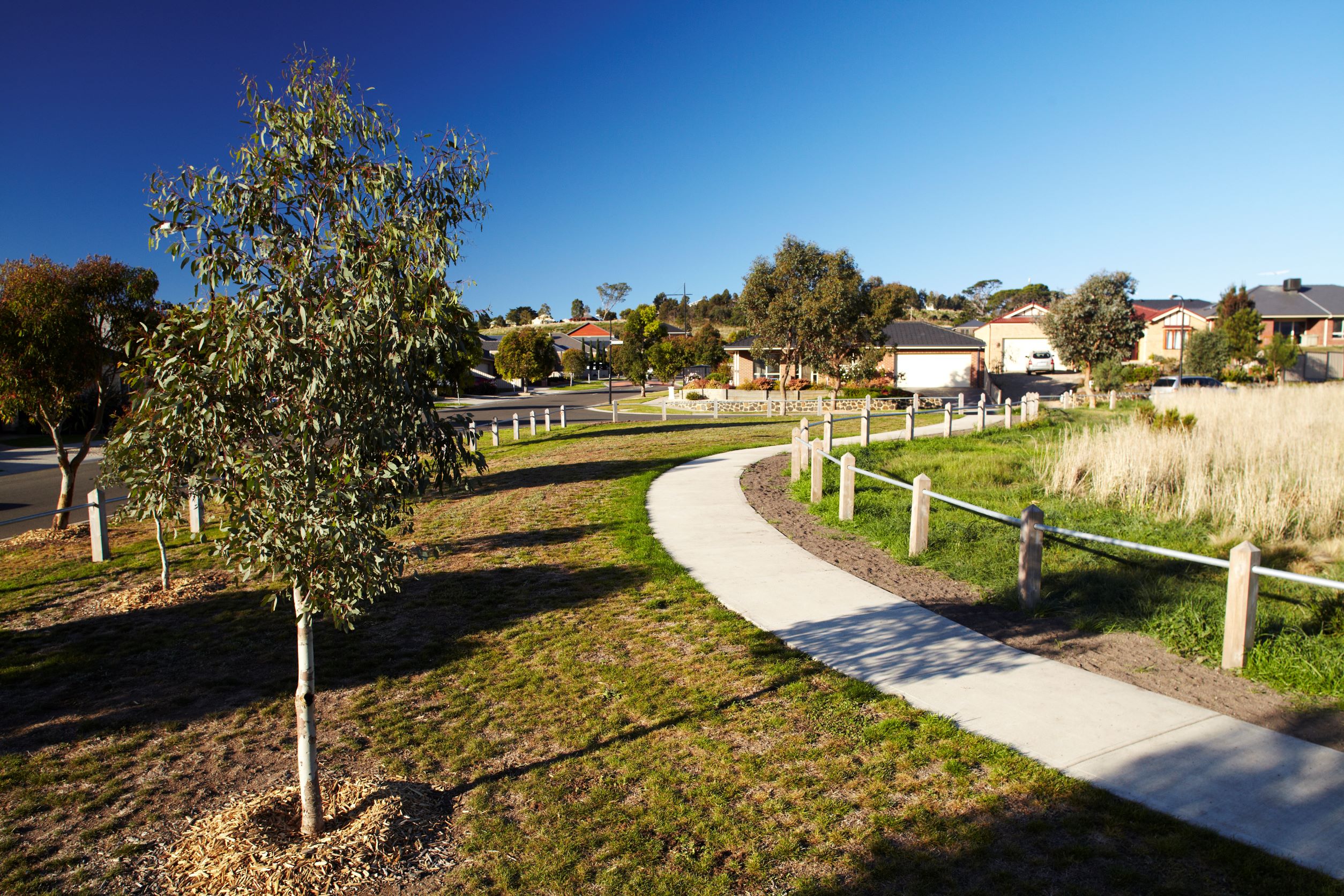 A residential estate with parkland and footpath